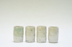 Porcelain unomis. Celadon with wax resist and pencil markings. Each 8cmh.