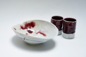 Porcelain bowl and unomis. Traditional oxblood glaze